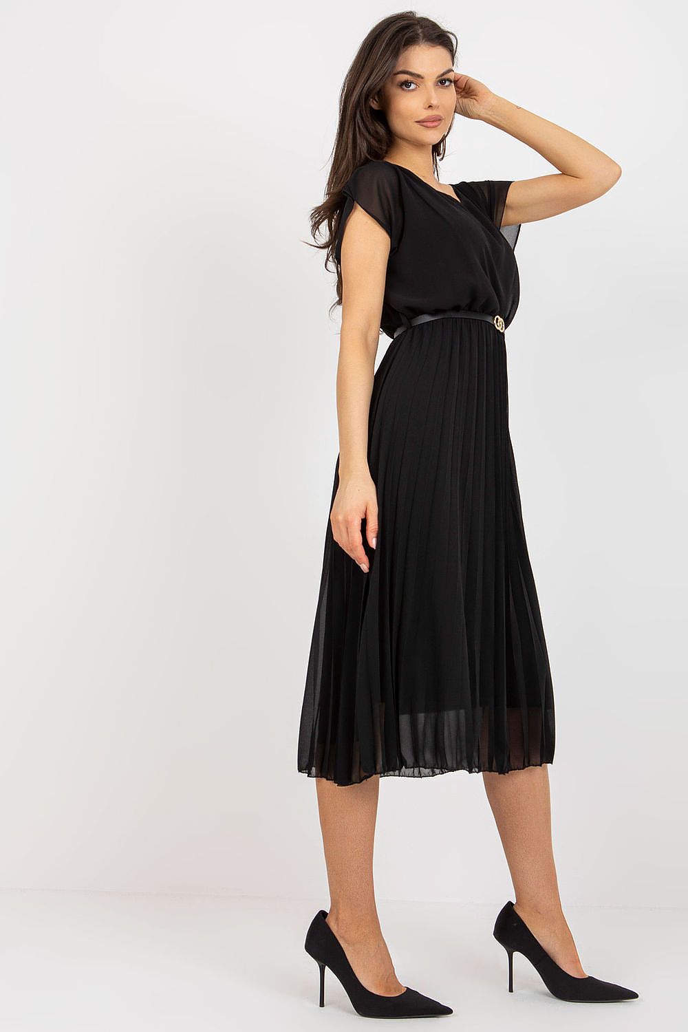 Woman wearing a black dress on a white background