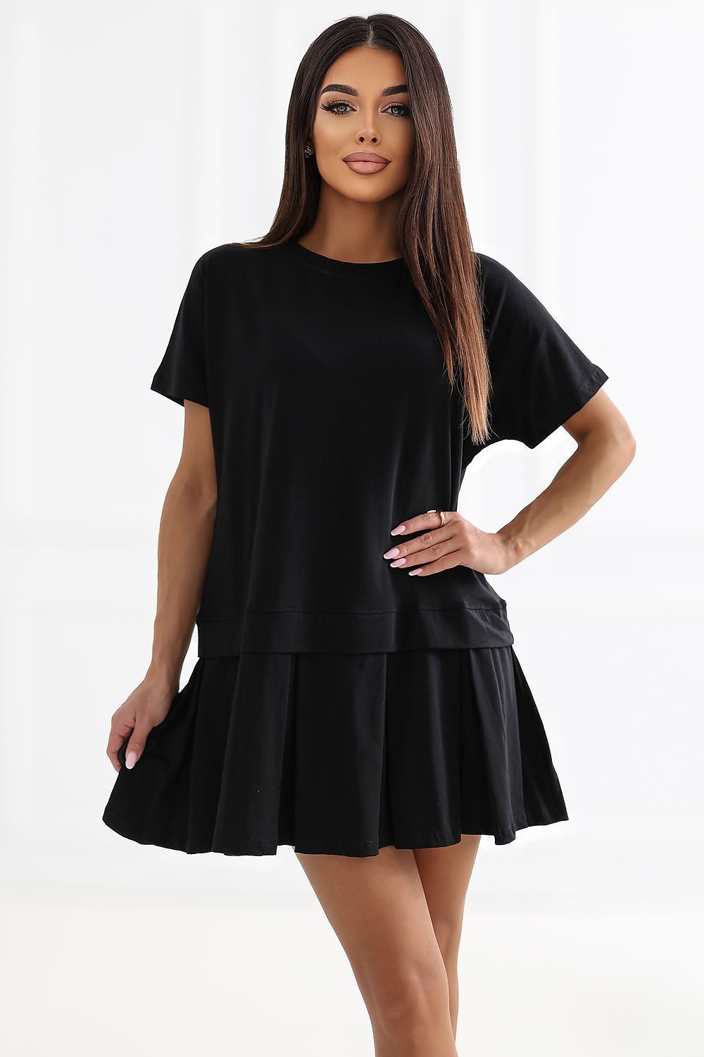 Woman wearing a black dress on a white background