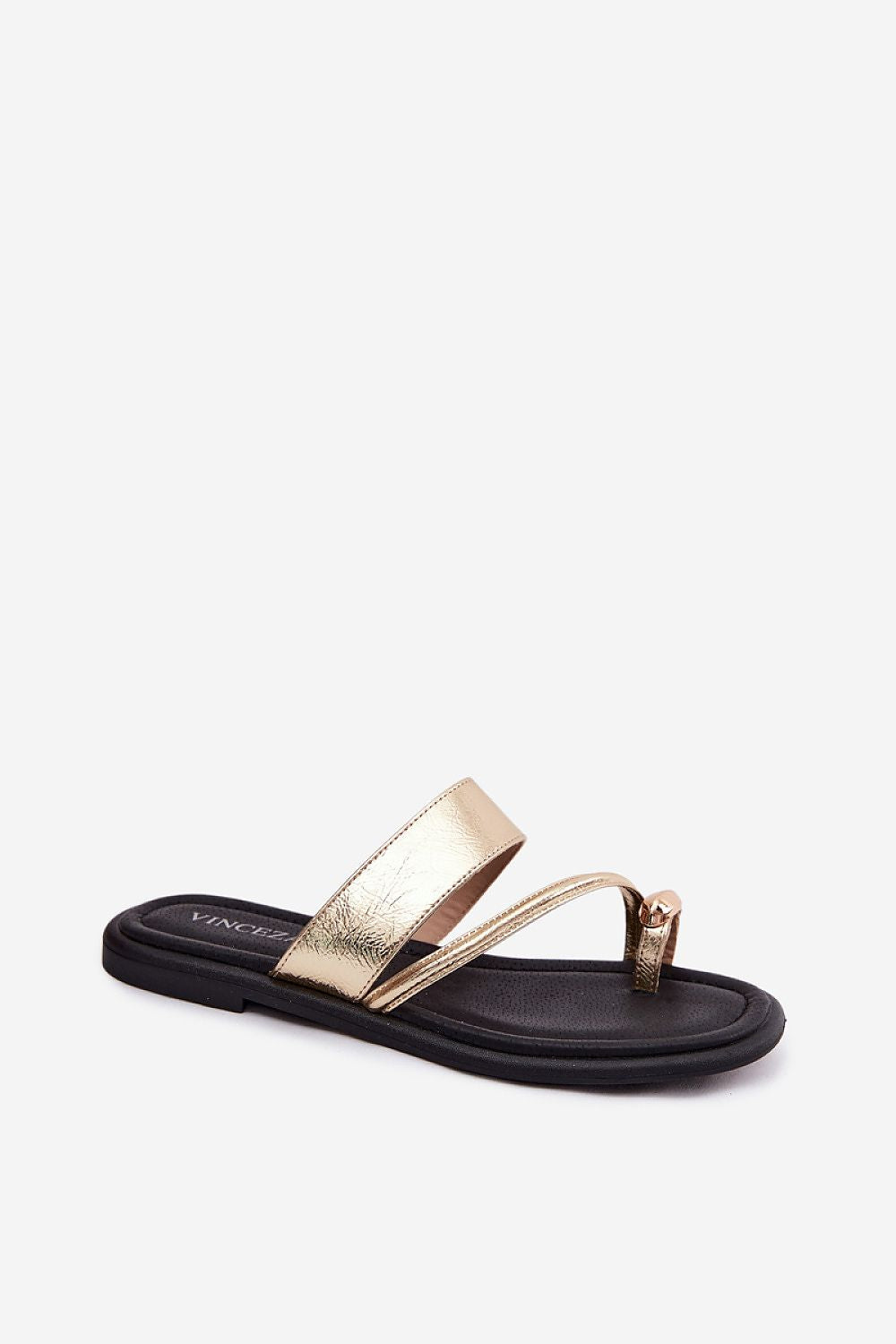 Black sandal with gold strap on a white background