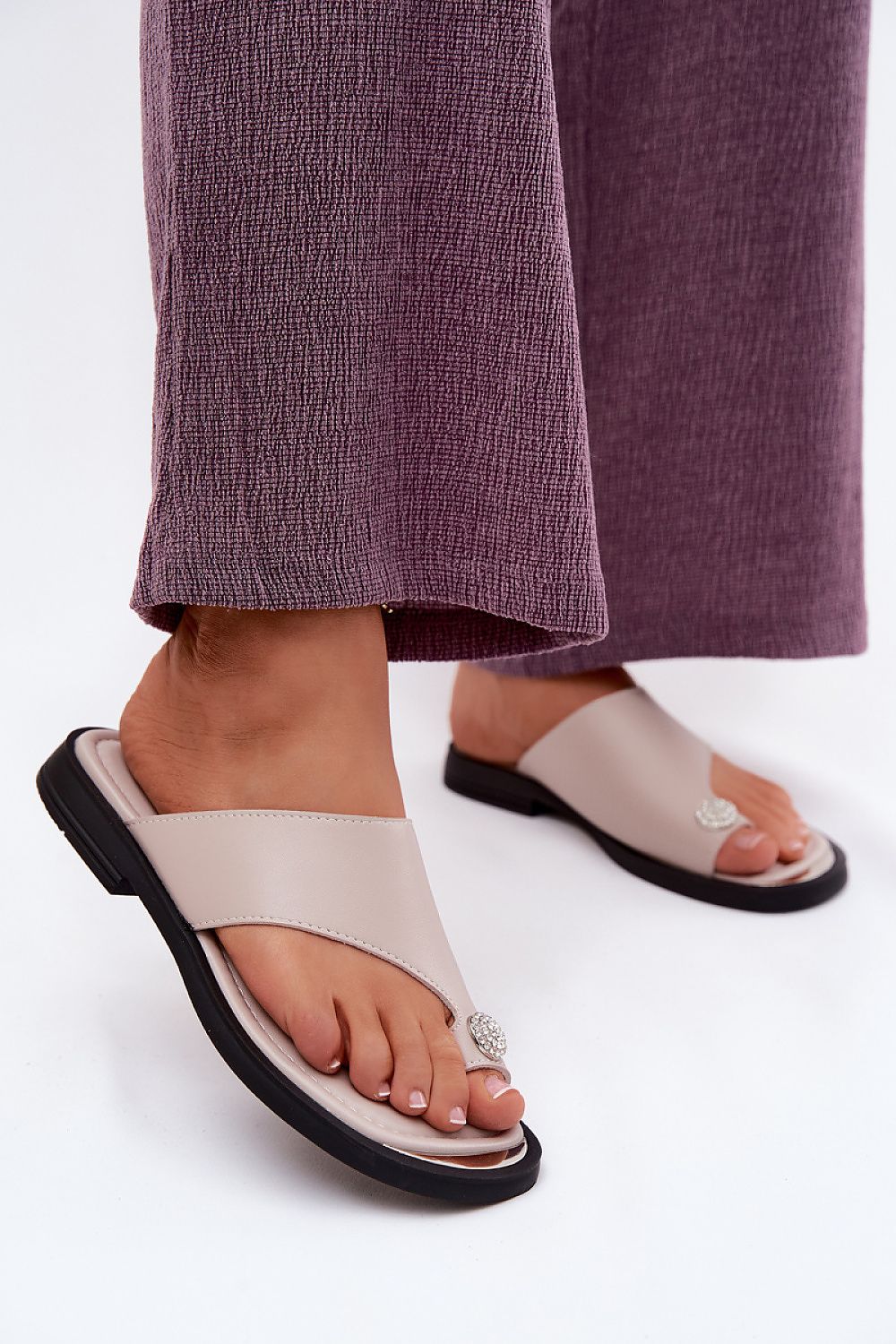 Beige natural leather slide sandals with elegant decorative detail
