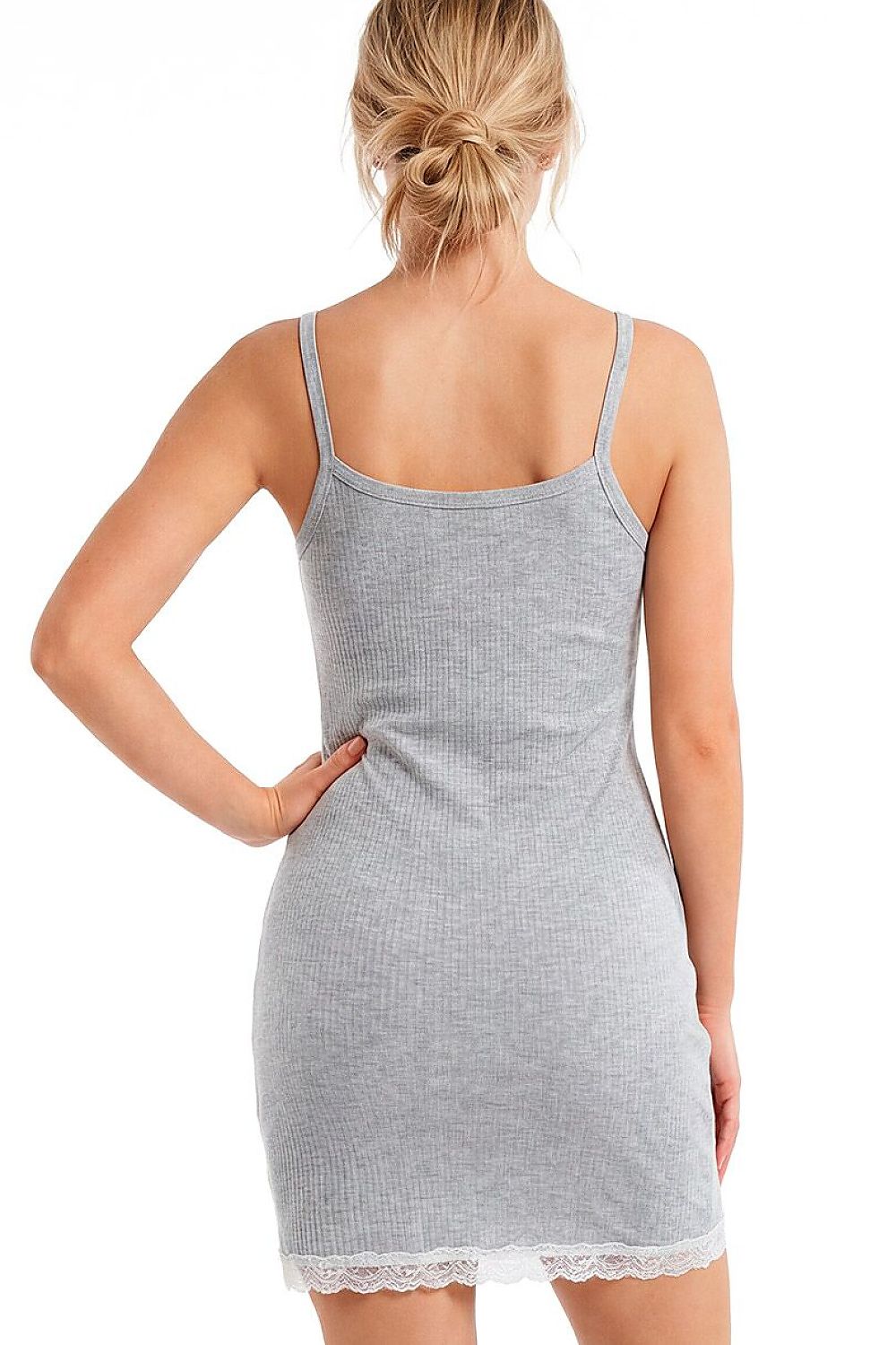 Woman wearing a gray tank dress with lace trim on a white background