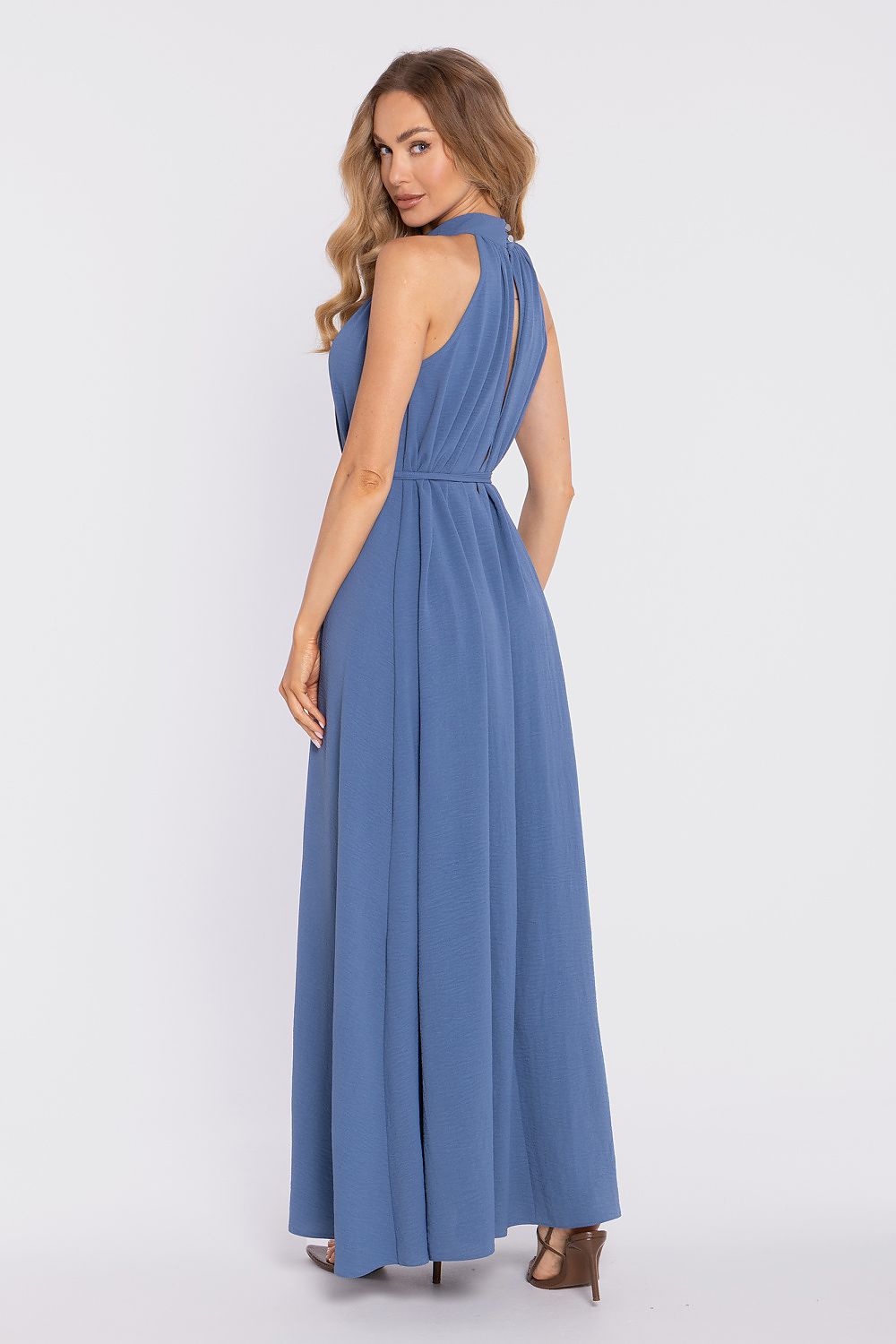 Woman wearing a blue dress on a white background