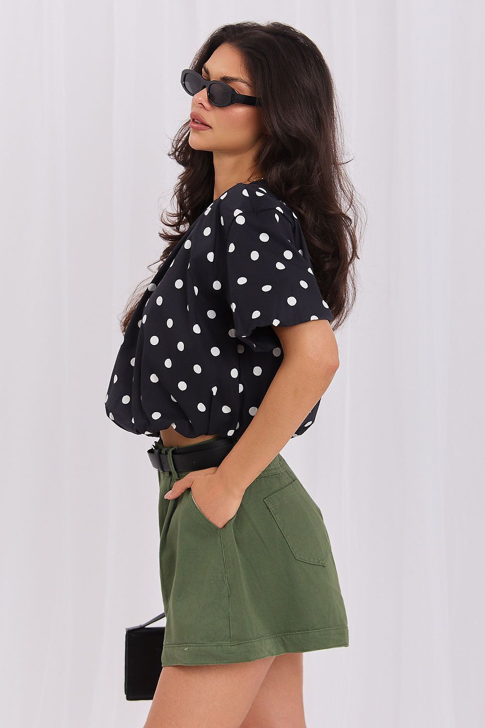 Black polka dot blouse with flattering cropped fit and classic round neckline