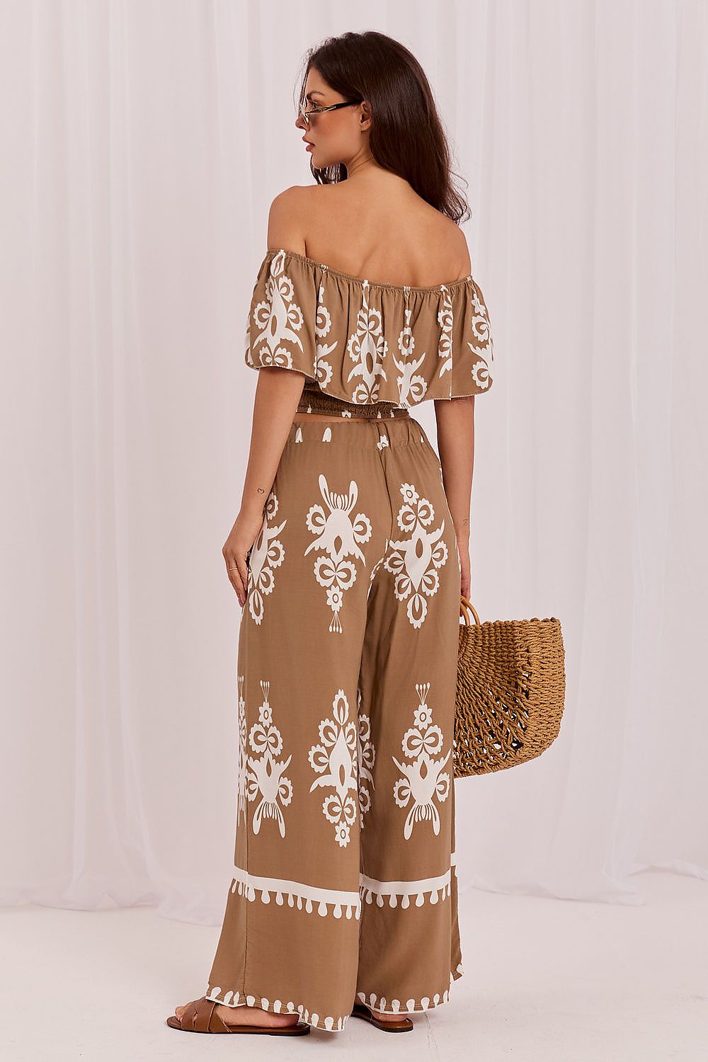 The Santorini Boho Co-Ord Set in beige featuring a Bardot blouse and matching printed trousers
