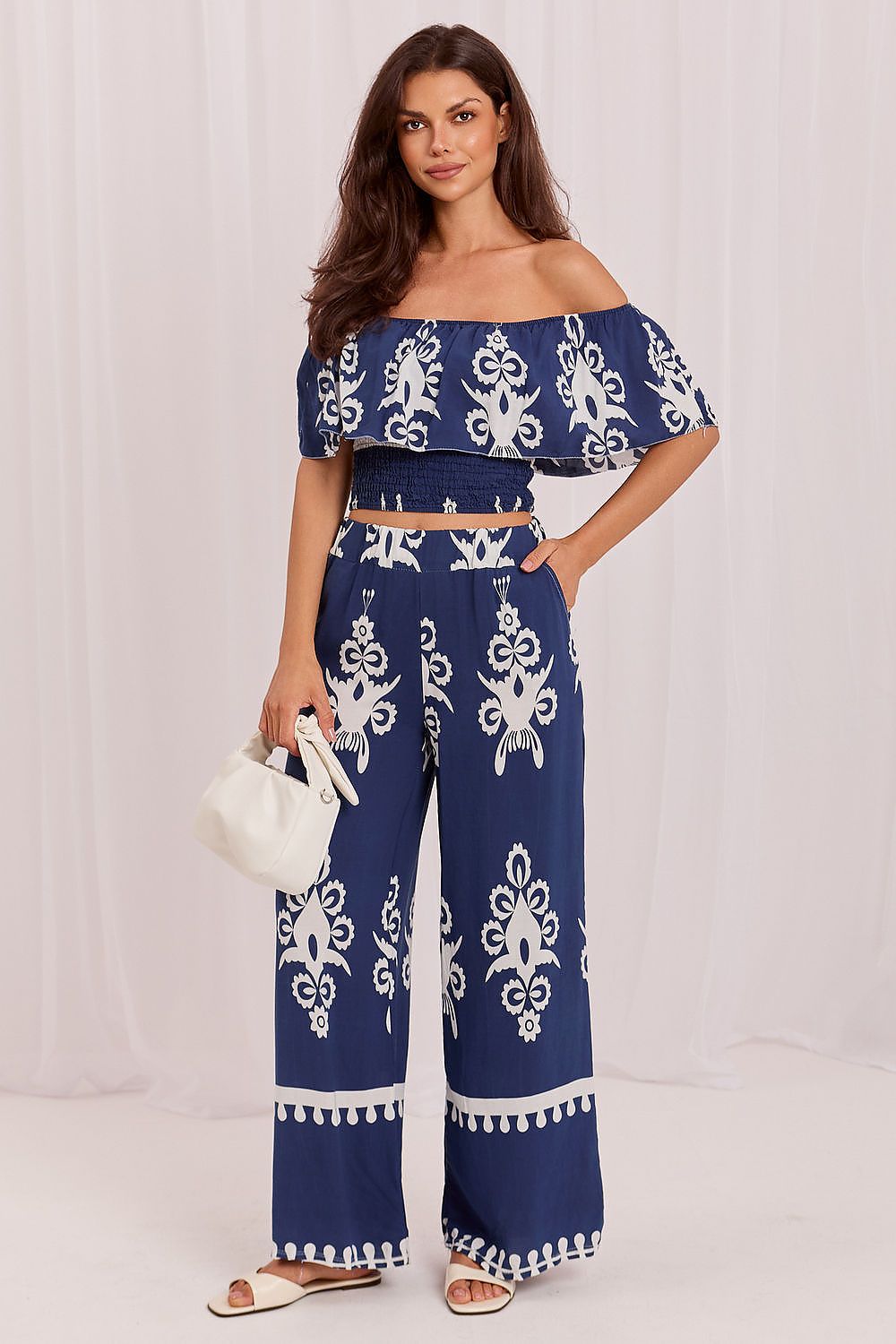 The Santorini Boho Co-Ord Set in blue featuring a Bardot blouse and matching printed trousers