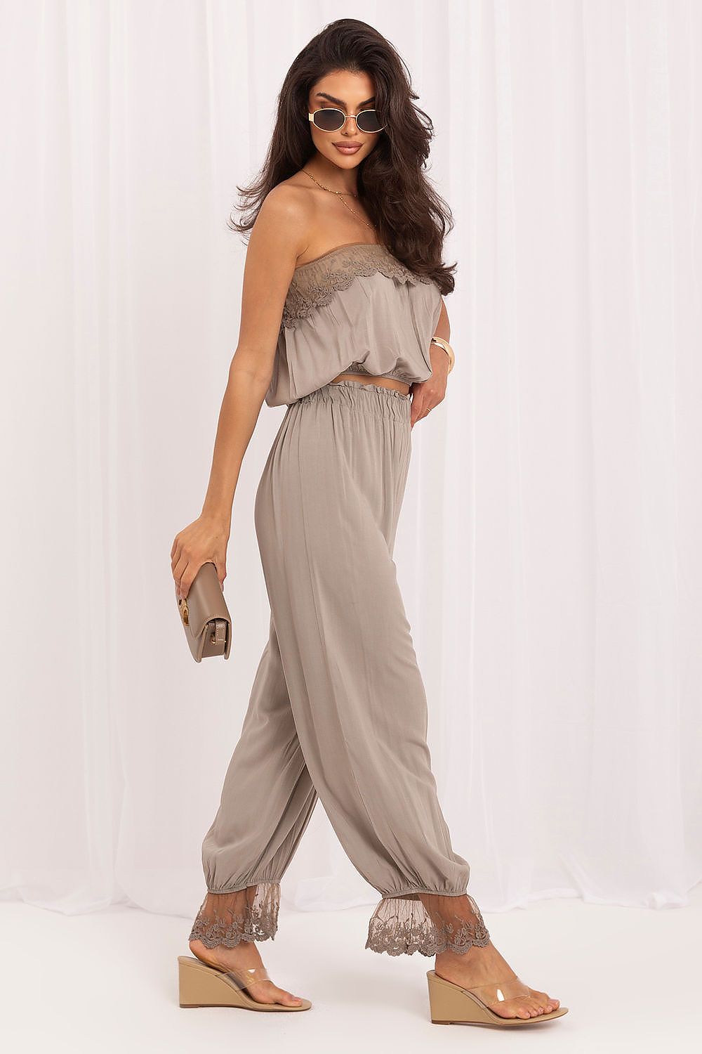  The Capri Lace Co-Ord Set in beige featuring a lace-trimmed crop top and matching full-length trousers-2