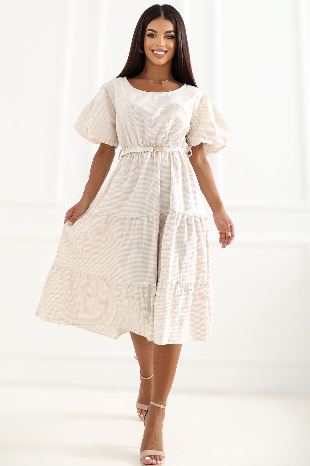  The Amelia Gingham Midi Dress in beige featuring a timeless check pattern, puff sleeves and a flattering belted waist