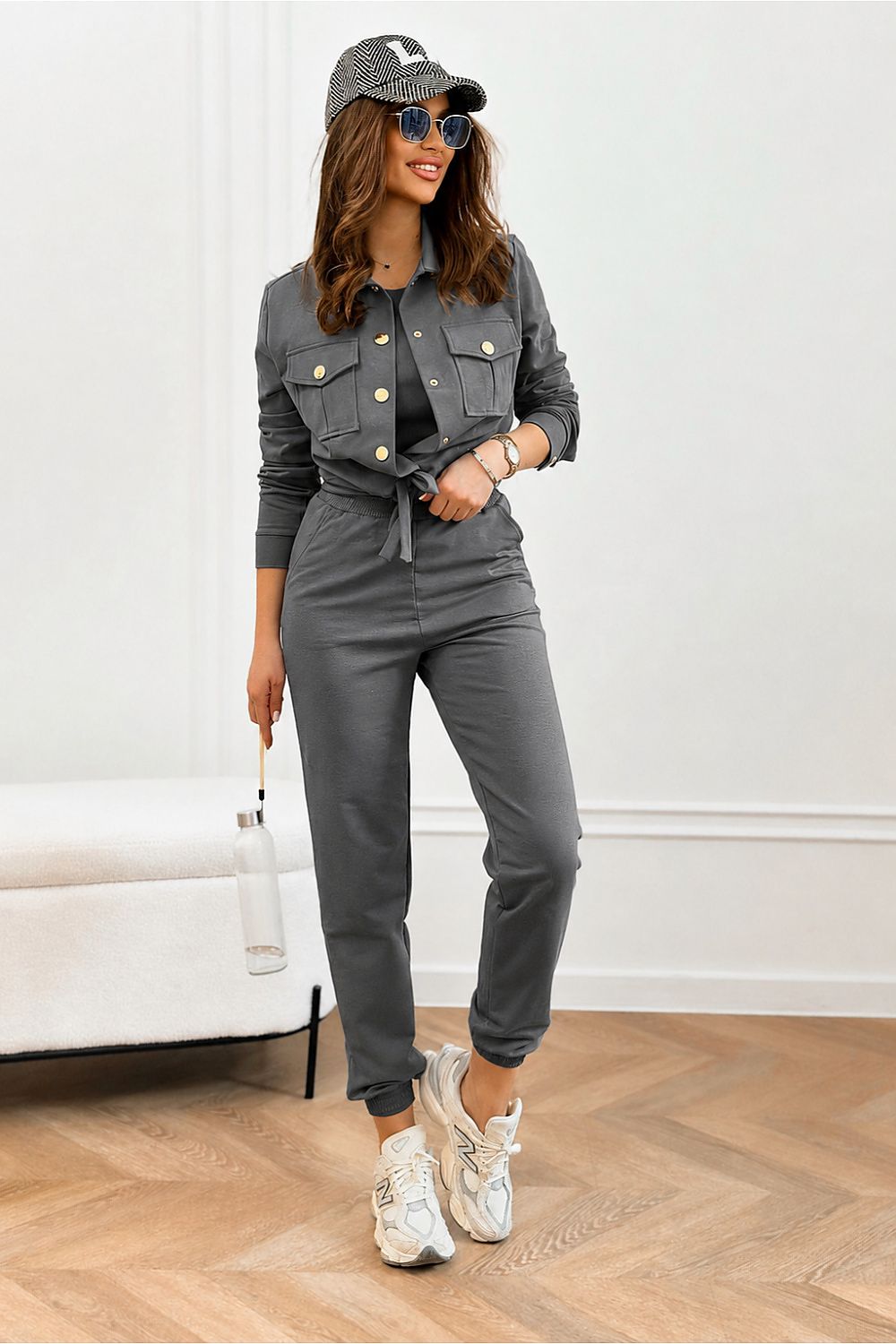  Women's rich-grey three-piece tracksuit set with top, jacket and trousers.