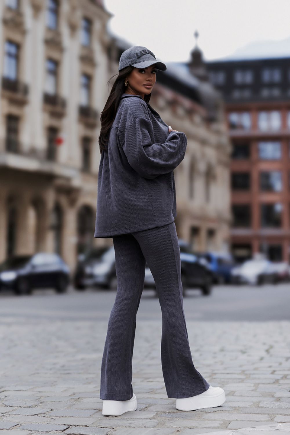  Women's blue corduroy two-piece set with relaxed Shirt and matching trousers.