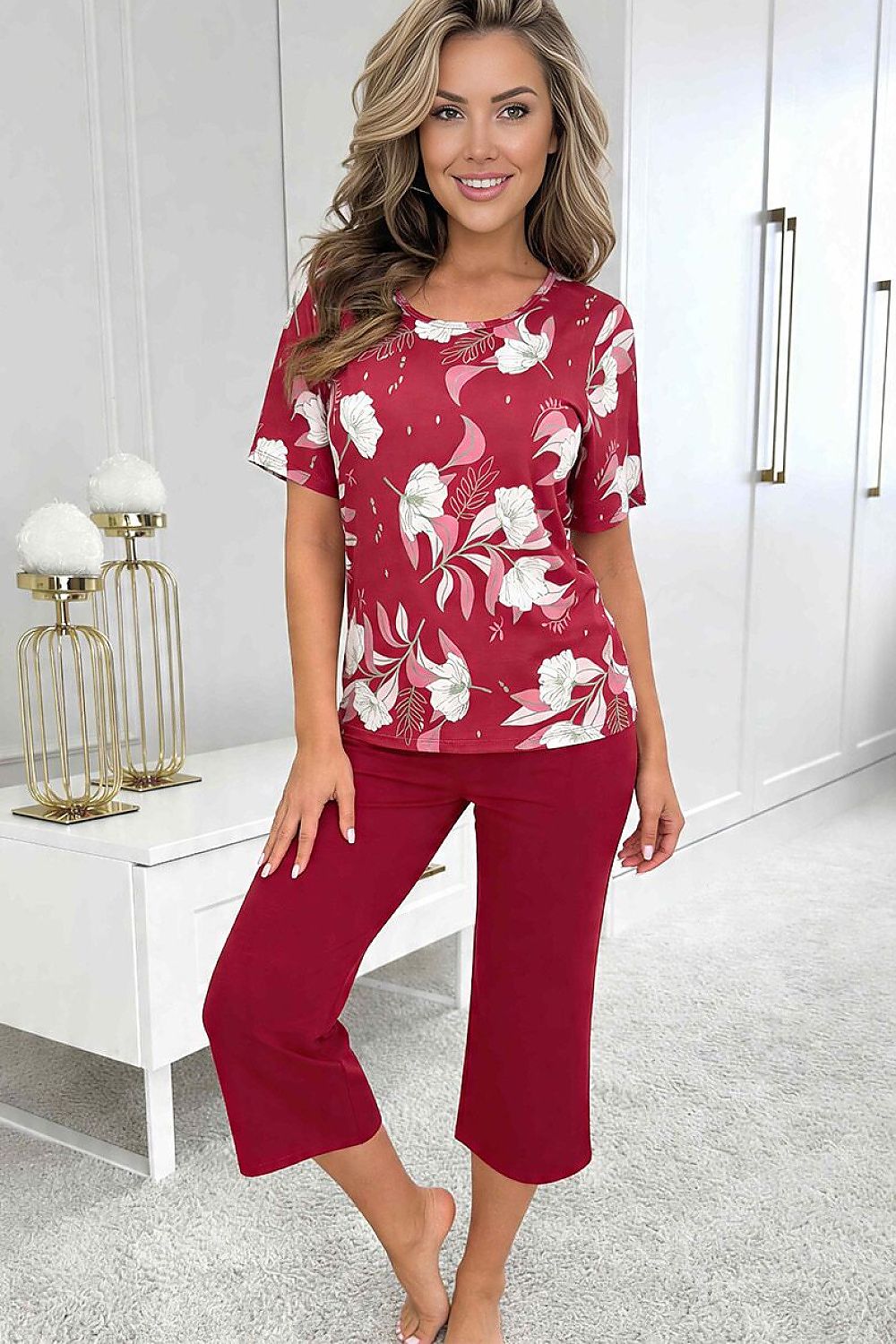  Women's Brigitte red floral pyjama set with a patterned top and burgundy three-quarter-length trousers. 2