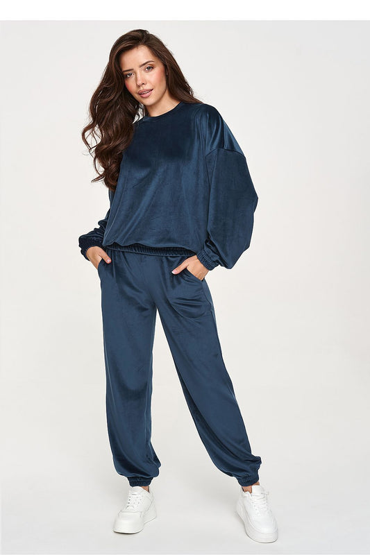 Women's blue velour two-piece set with relaxed sweatshirt and jogger trousers.