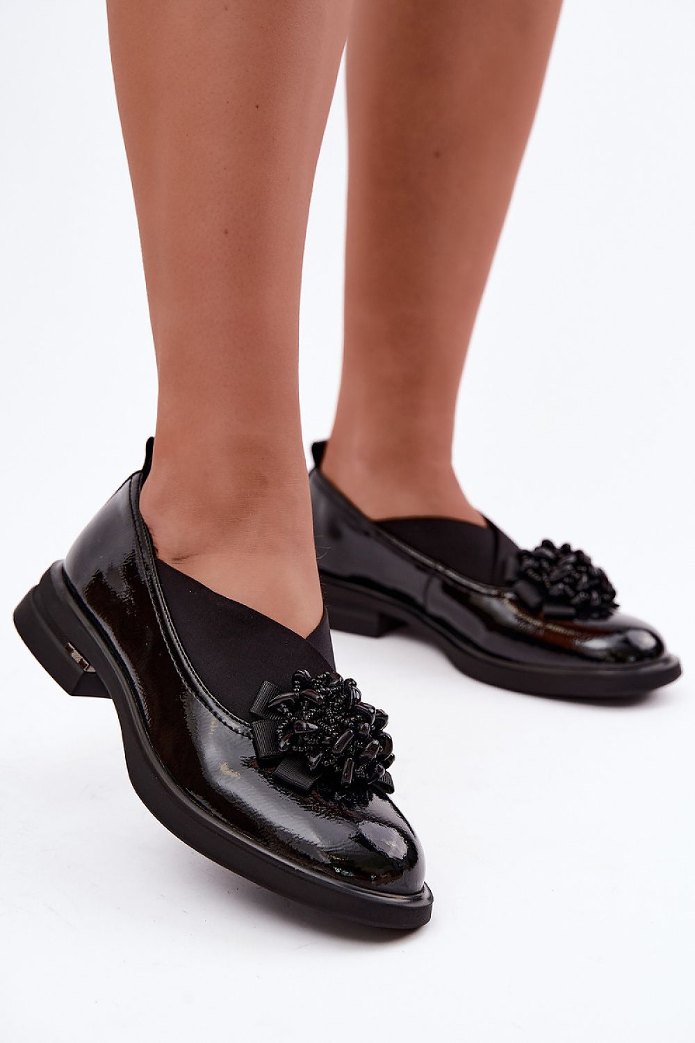  Women's black natural leather shoes with decorative ornament and flat heel