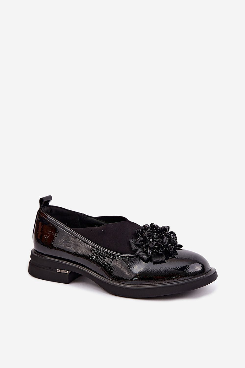 Black loafer shoe on a white background