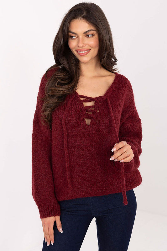Women's red sweater with corset-style front lacing and long sleeves