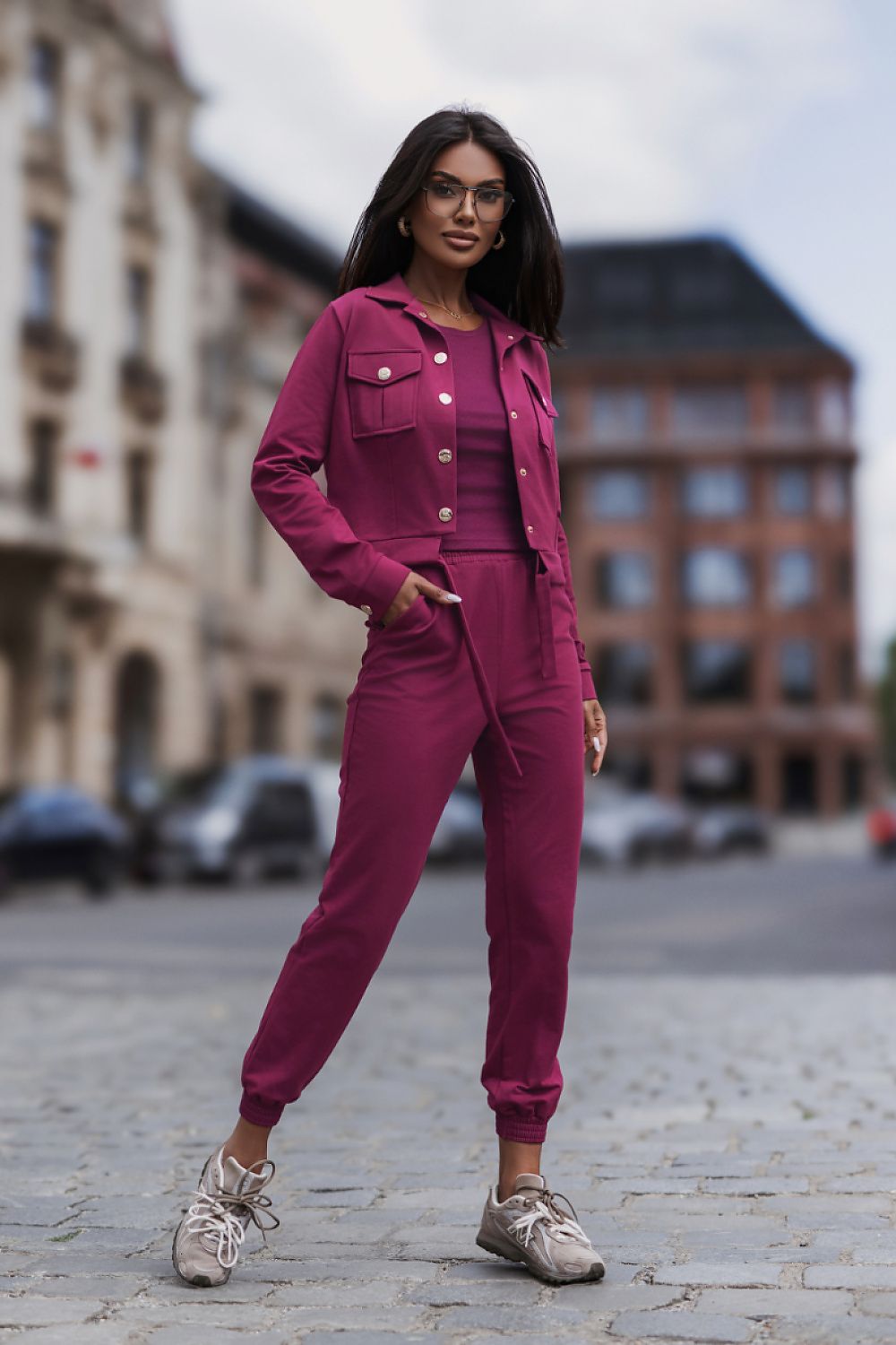Pink women's matching outfit featuring a short jacket and elasticated waist trousers
