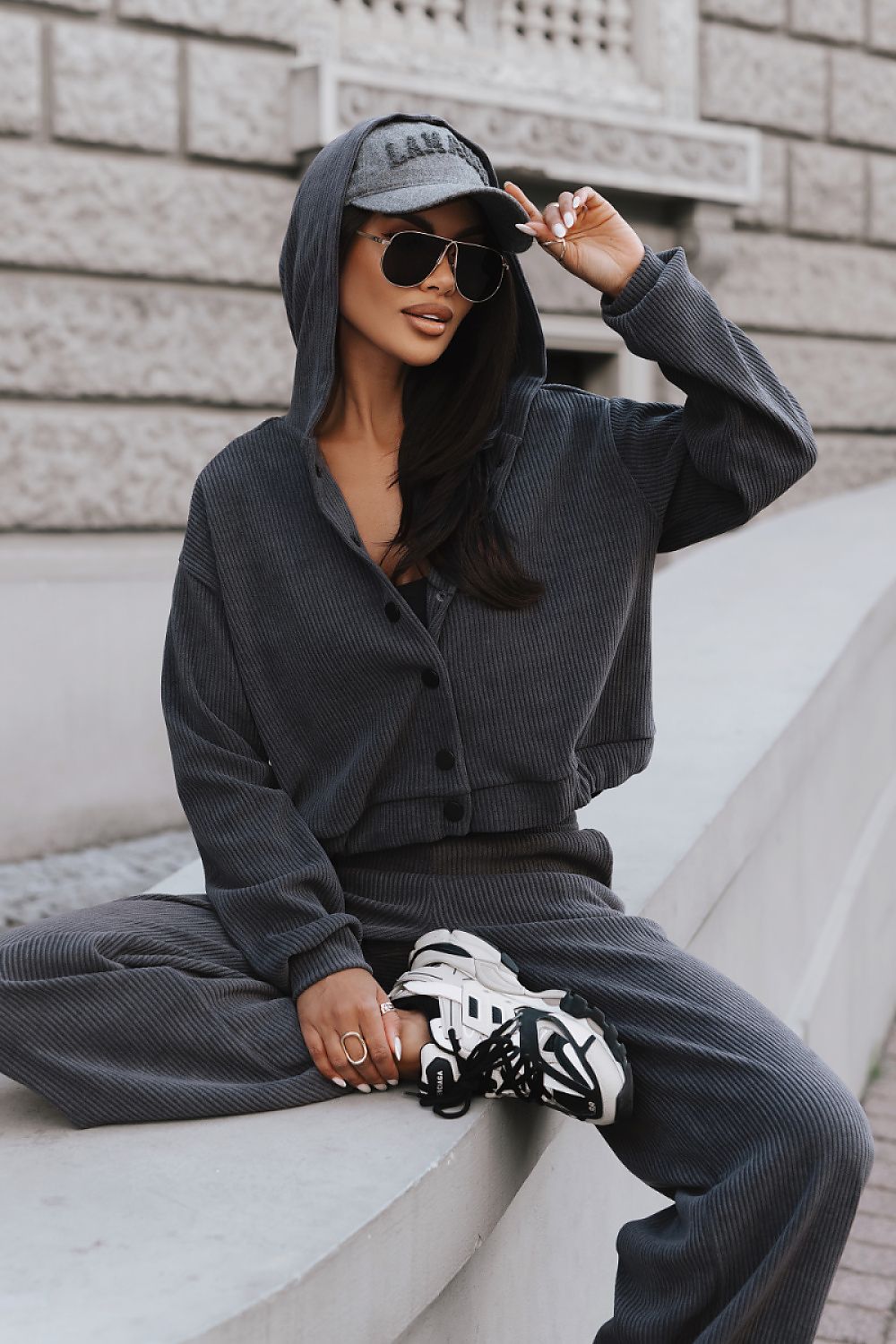 Grey women's two-piece casual set featuring a hoodie and matching trousers