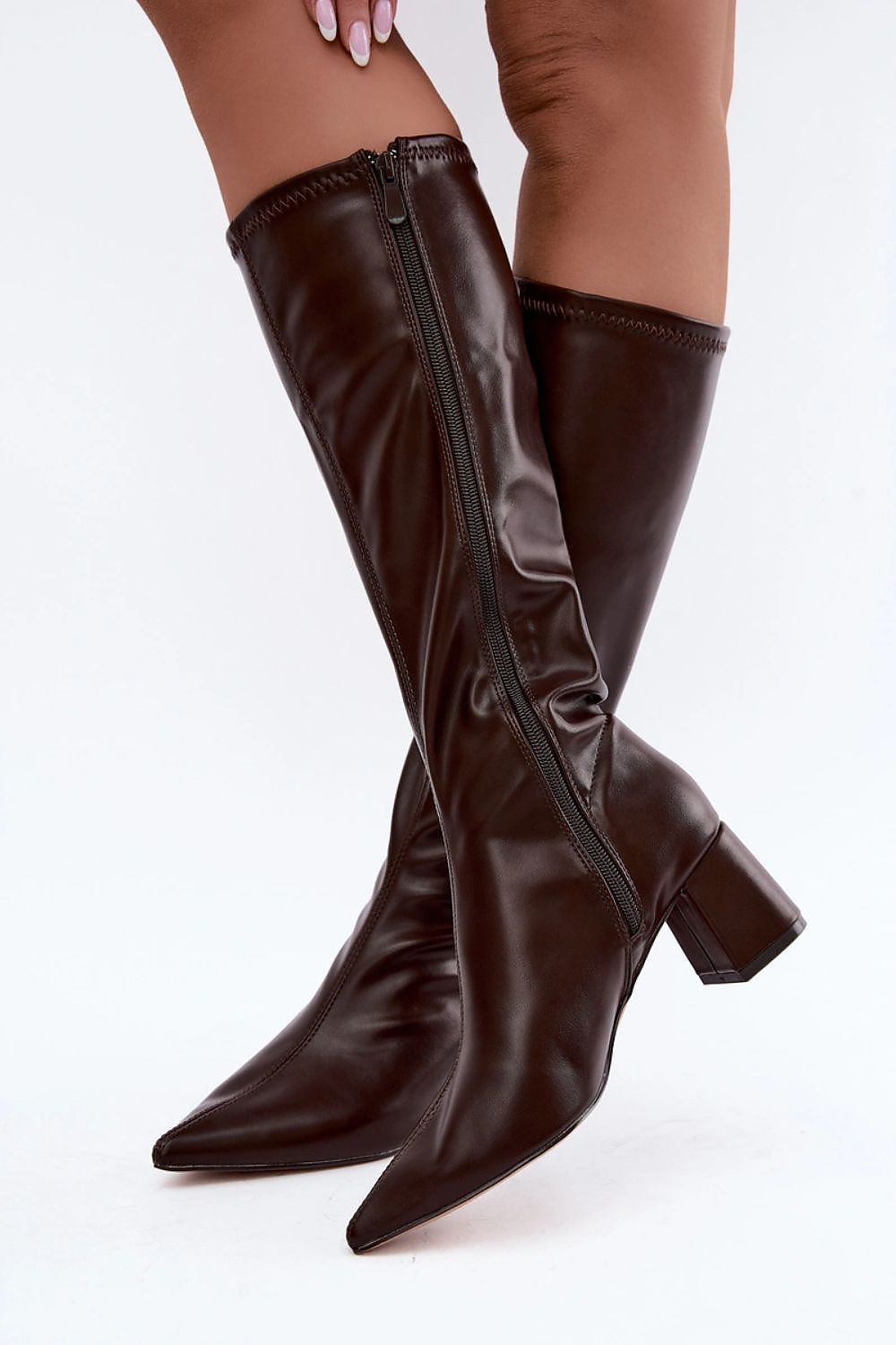 Elegant brown heeled ankle boots styled for autumn and winter