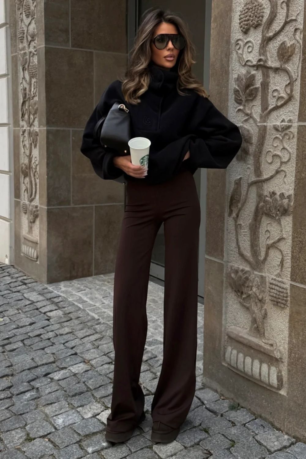 Black relaxed fit women's sweatshirt styled with jeans-2