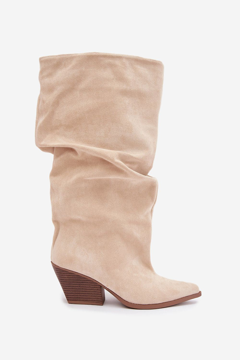 A mid-calf slouchy boot in beige suede with a brown stacked block heel, shown from a side profile on a light gray background.