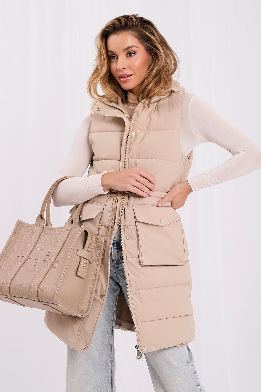 Beige longline quilted gilet with concealed zip and snap-button front flap