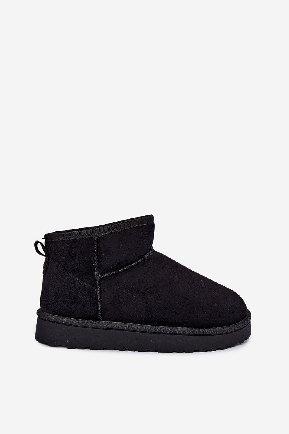 A black knit and suede sneaker with a white midsole and a small yellow pull tab, shown in a side profile on a light gray background.