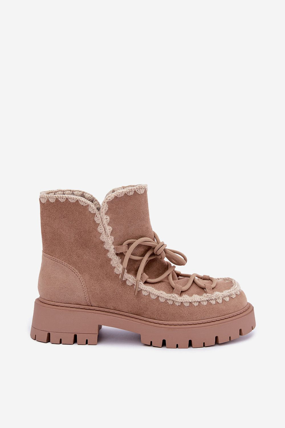 A single ankle boot in a dusty rose-brown suede-like material, featuring a chunky lug sole, matching laces, and a decorative cream-colored scalloped trim along the collar and around the laces, shown against a plain light gray background.