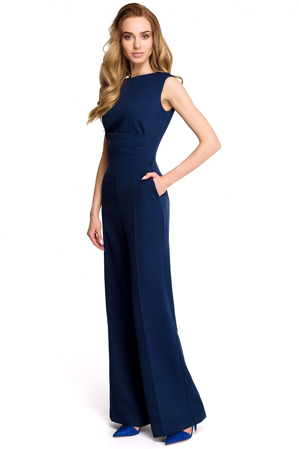 Woman wearing a navy blue evening gown on a white background