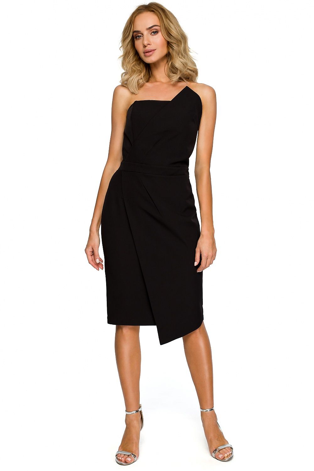 Woman wearing a black one-shoulder dress on a white background