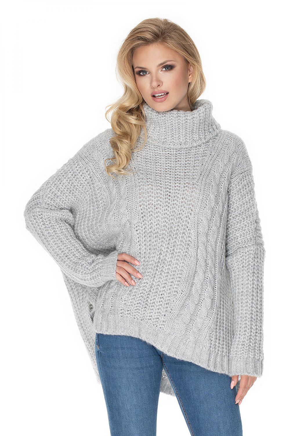 Woman wearing a gray knitted sweater on a white background