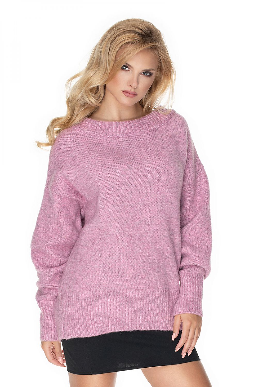 Woman wearing a pink sweater on a white background