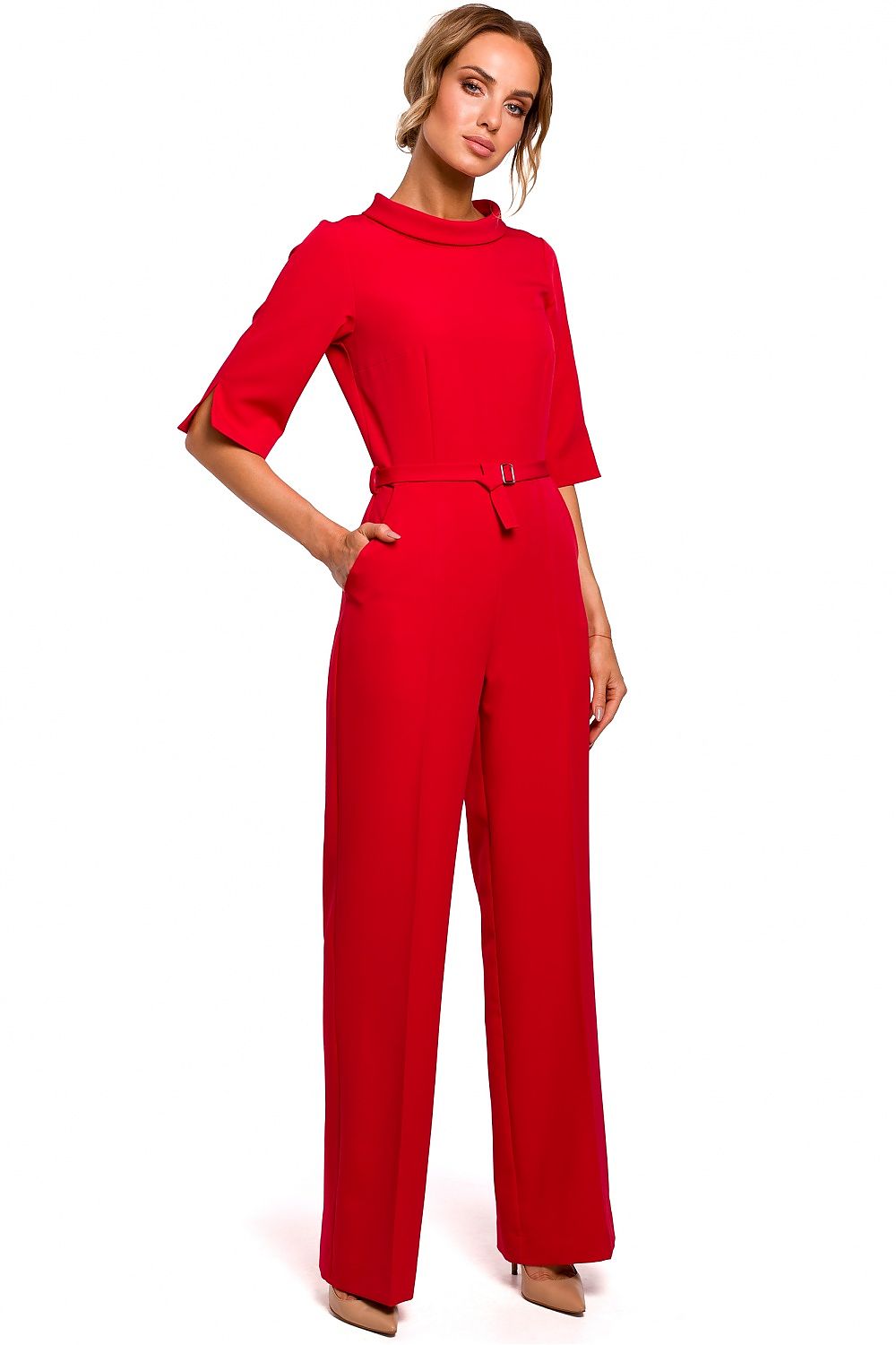Woman wearing a red jumpsuit on a white background