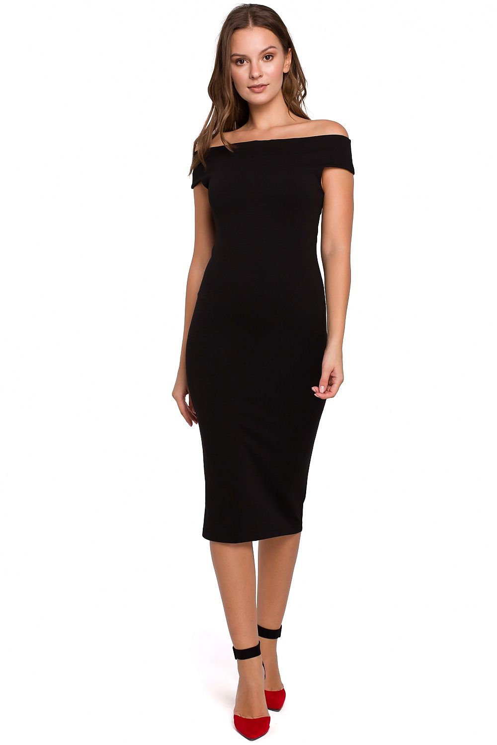 Woman wearing a black off-shoulder dress on a white background