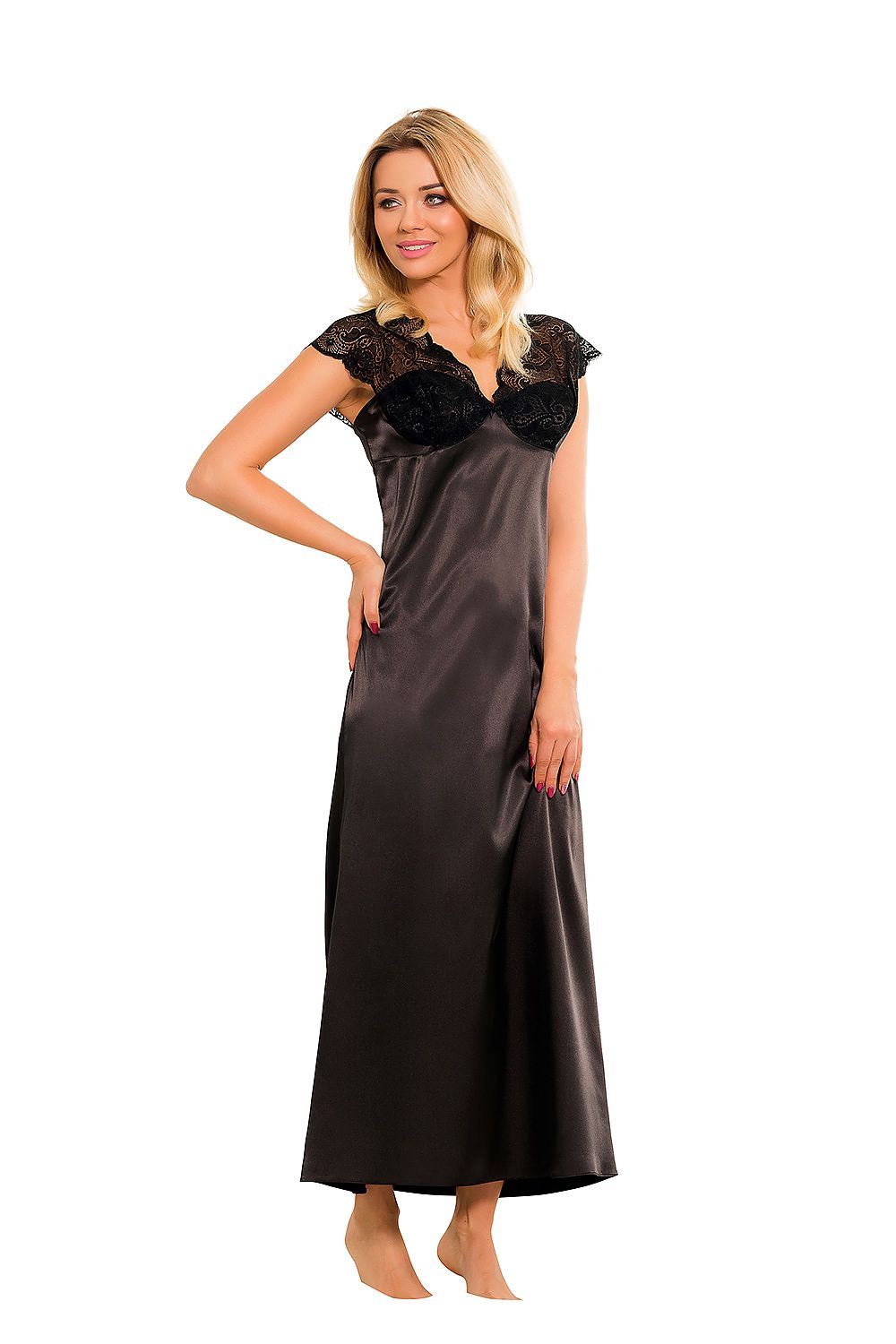 Woman wearing a long black satin nightgown with lace details on a white background
