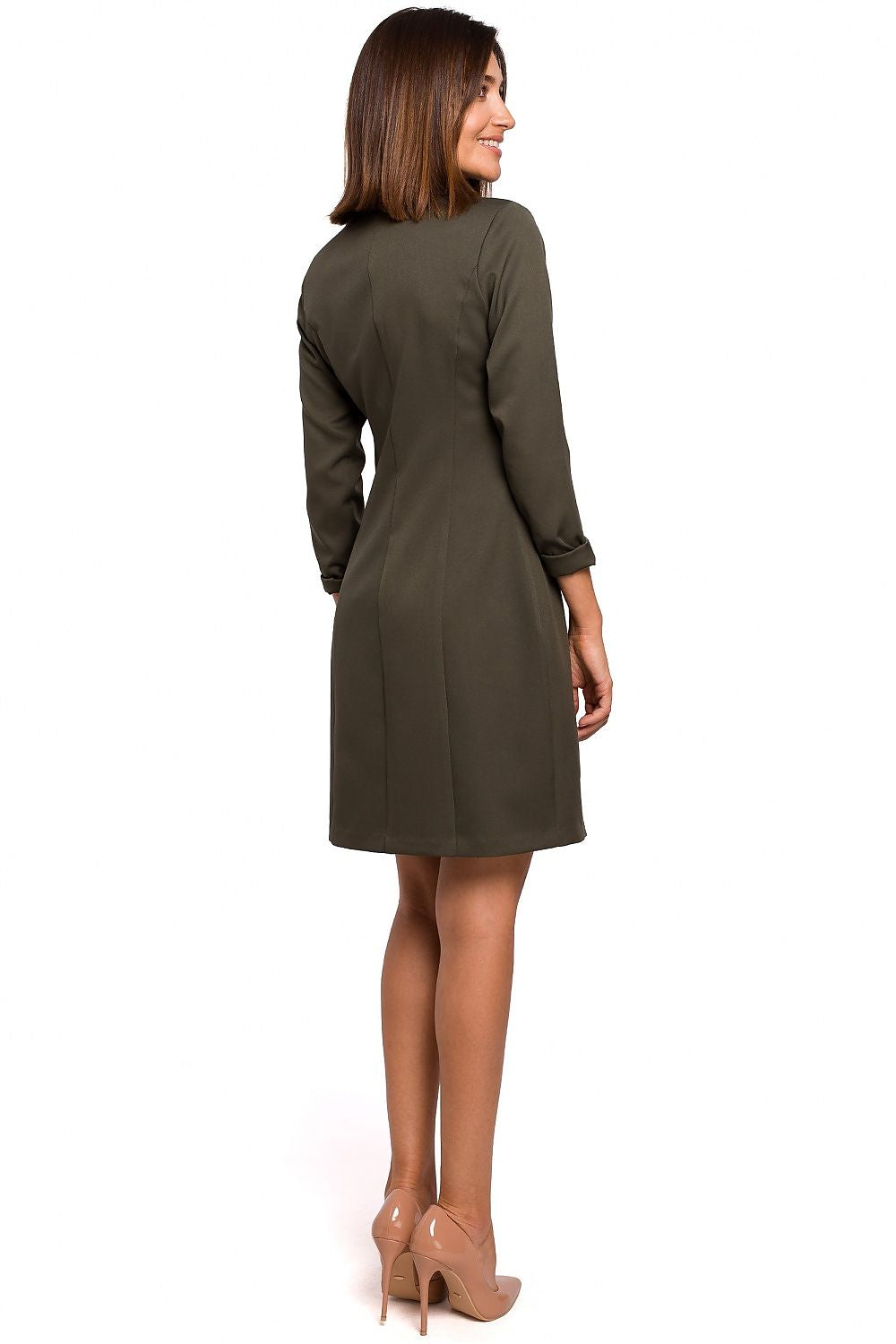 Woman wearing a green dress on a white background