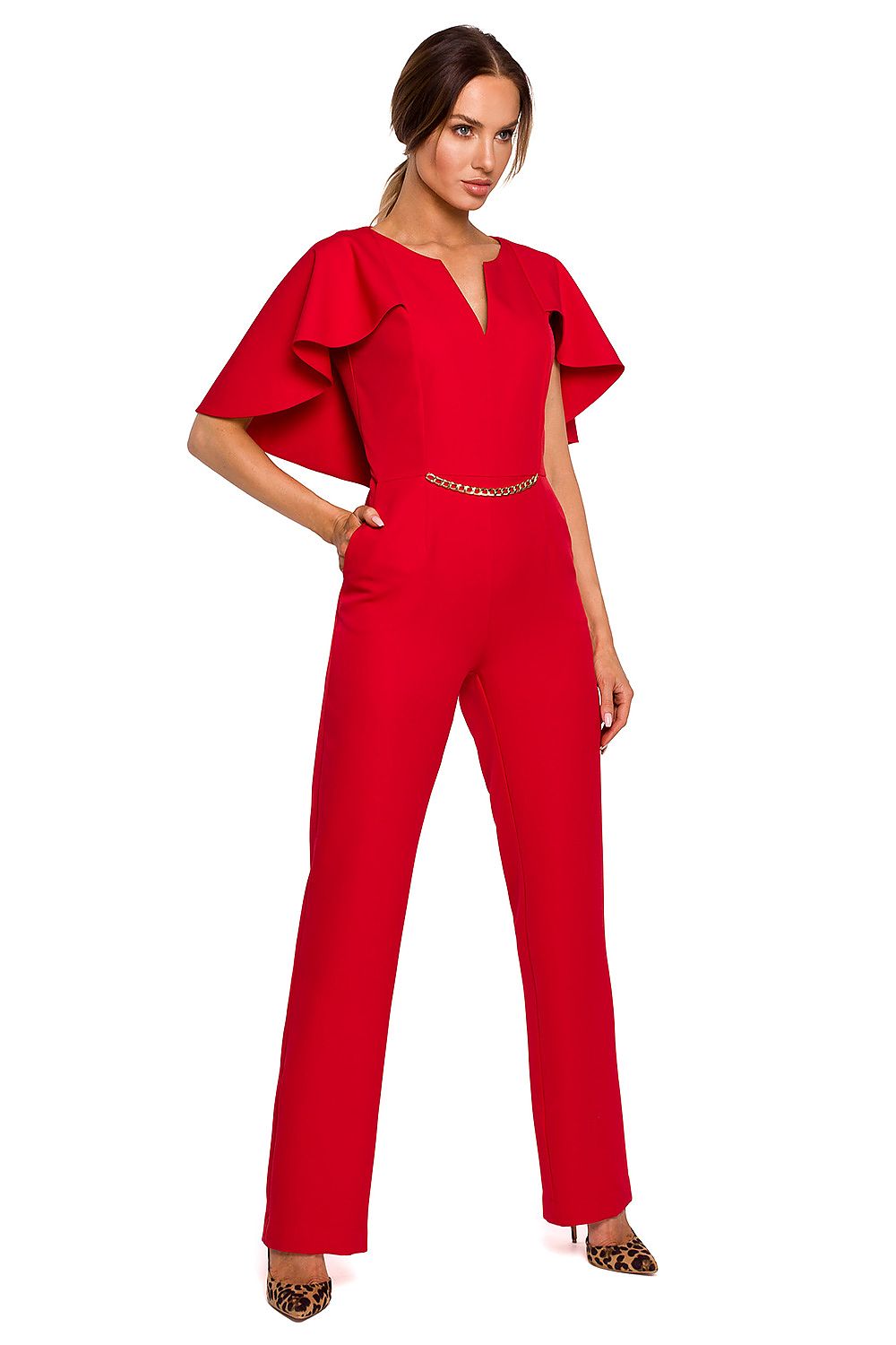 Woman wearing a red jumpsuit with ruffled sleeves on a white background