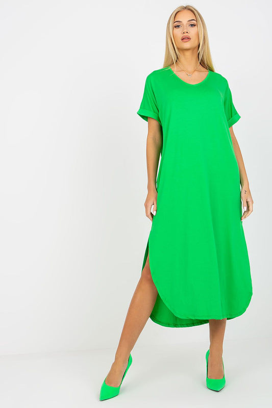 Woman wearing a green dress with a white background