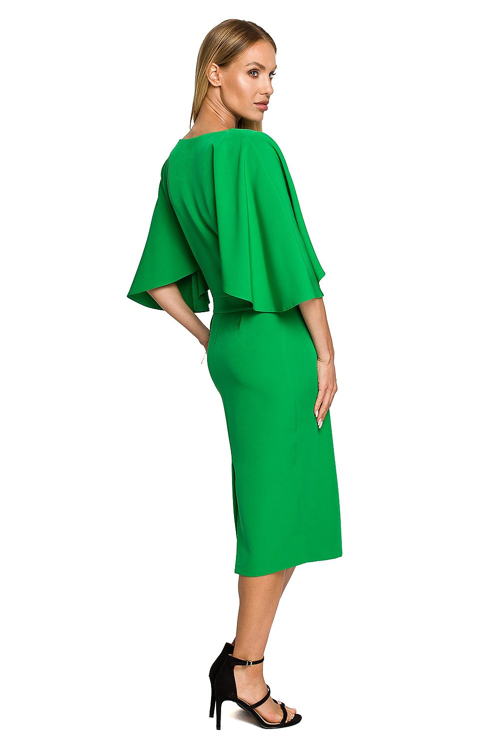 Woman wearing a green outfit on a white background