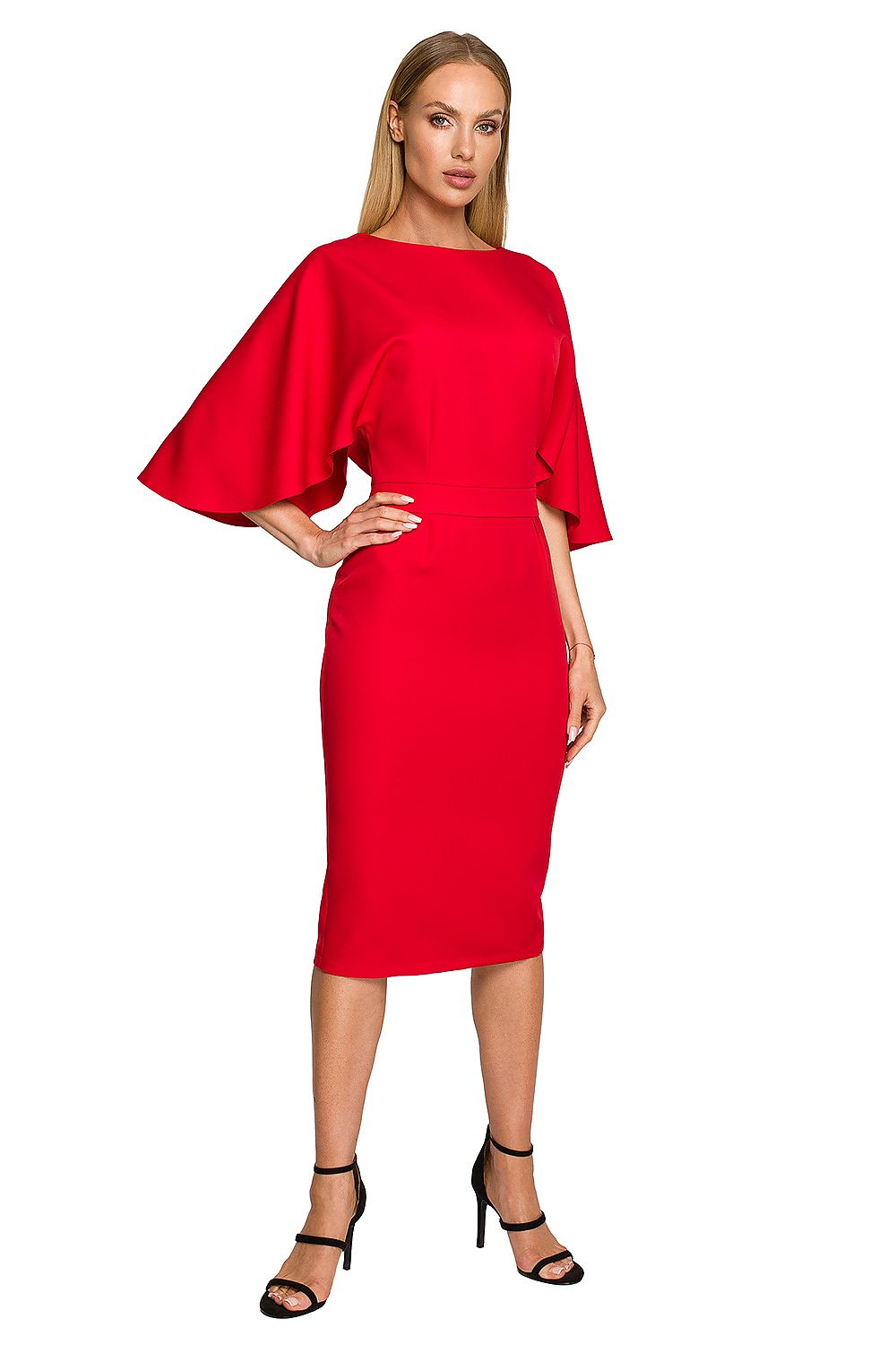 Woman wearing a red dress with cape sleeves on a white background