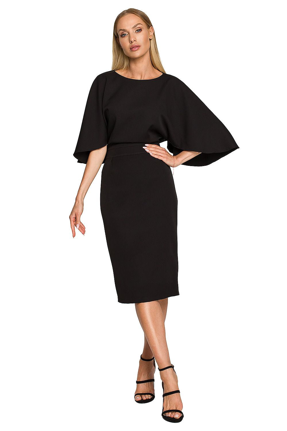 Woman wearing a black dress with cape sleeves on a white background