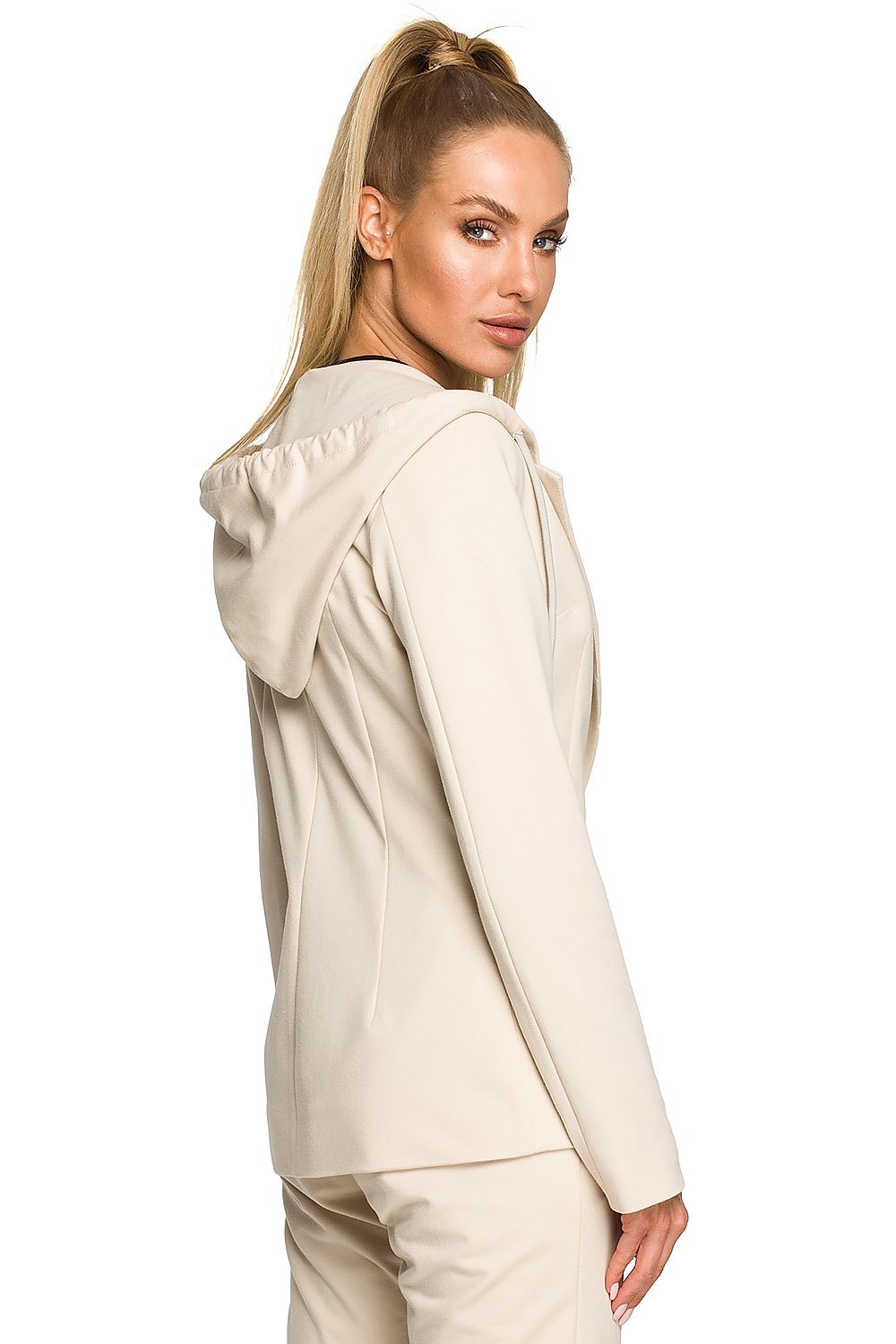 Woman wearing a beige hoodie on a white background