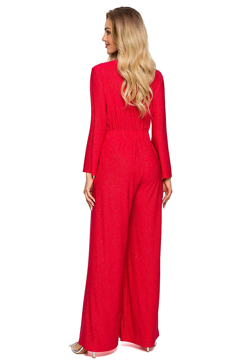 Woman wearing a red jumpsuit on a white background