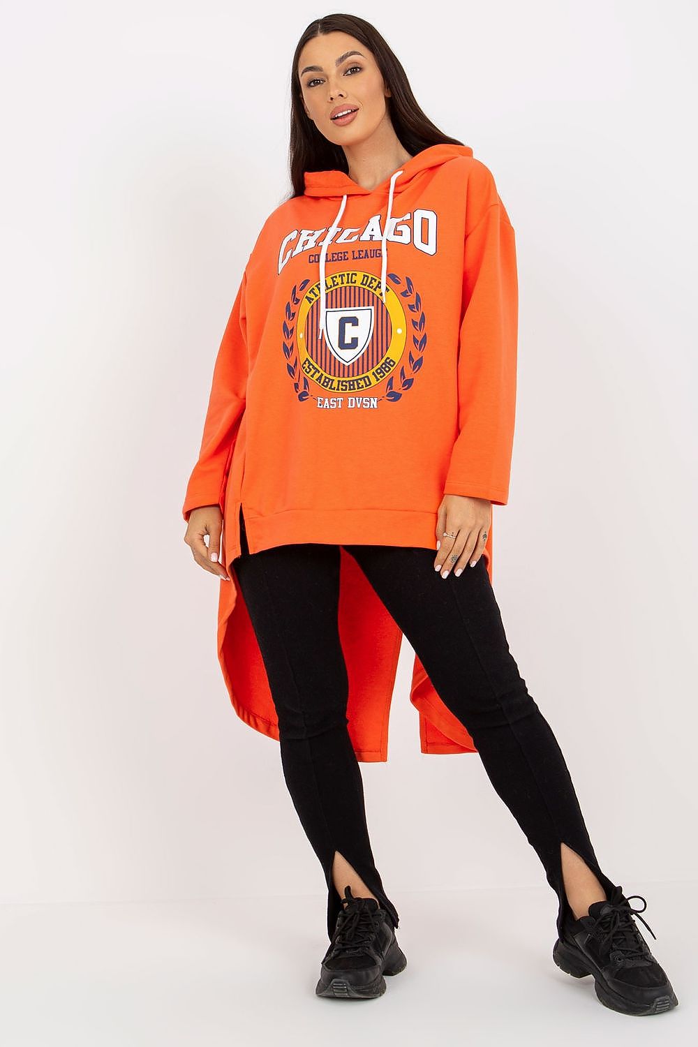 Woman wearing an orange hoodie with a logo on a white background
