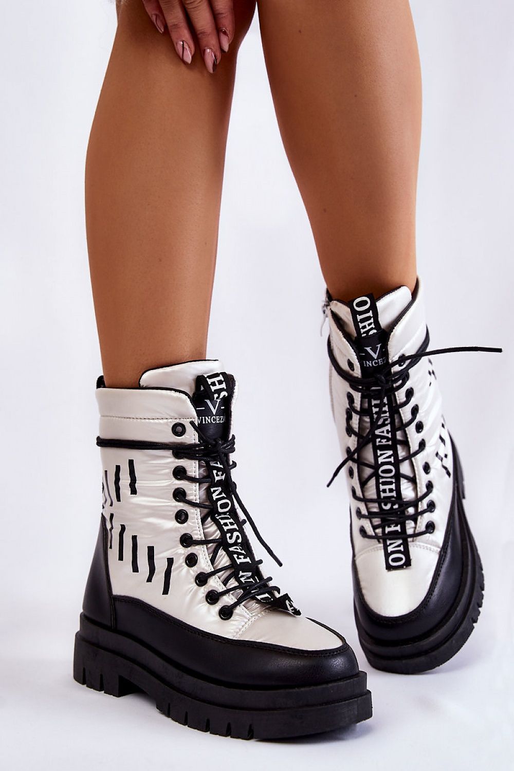 Close-up of fur interior and eco leather finish on women’s winter boots