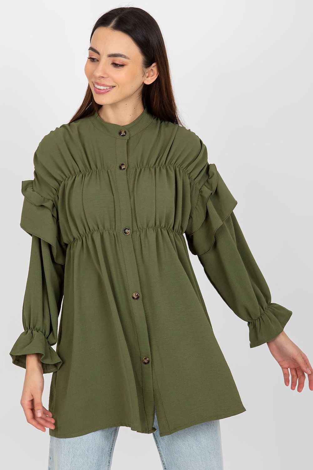 Woman wearing an olive green blouse with ruffled sleeves on a white background