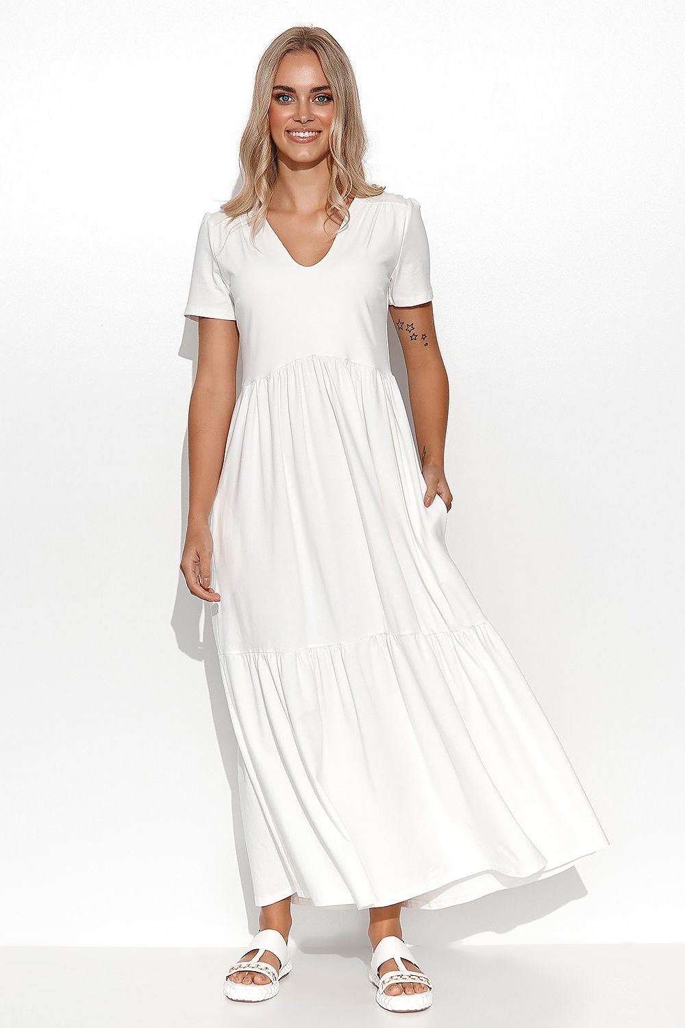 Woman wearing a white dress on a white background