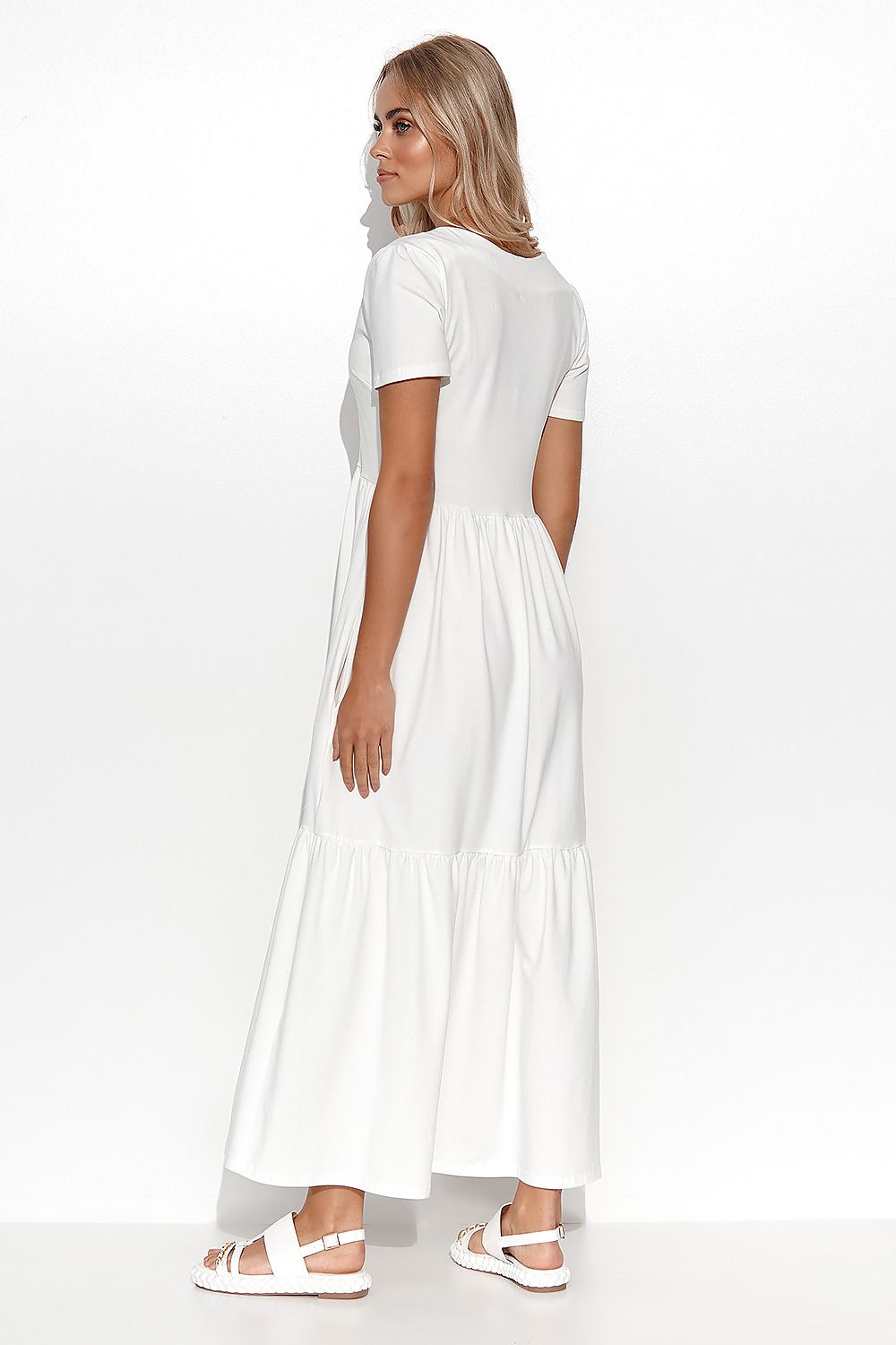 Woman wearing a white dress on a white background