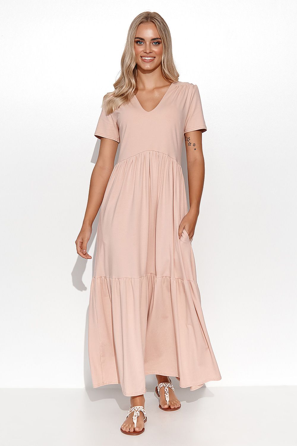 Woman wearing a pink dress on a white background