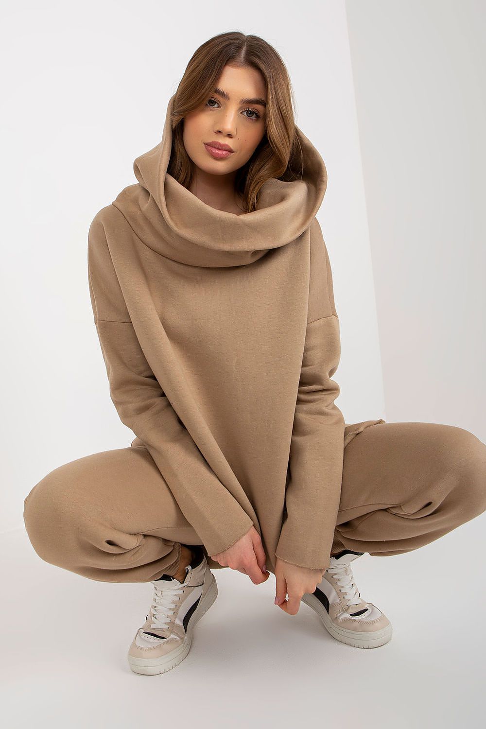 grey women’s hooded sweatshirt and pants with waist tie