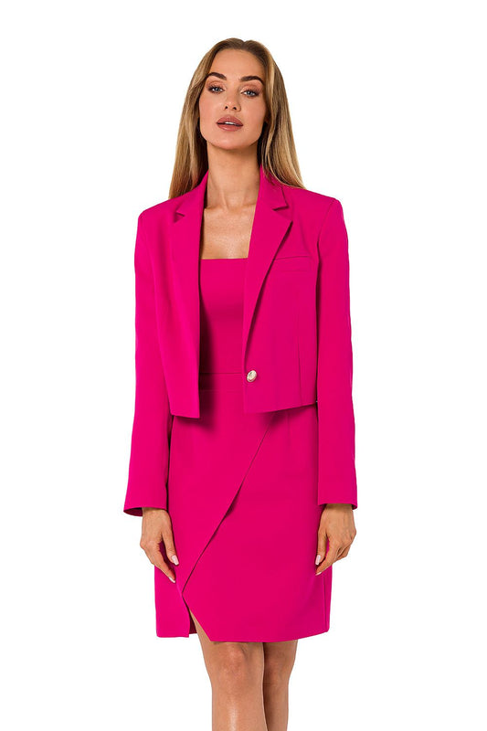 Woman wearing a bright pink suit with a matching dress on a white background