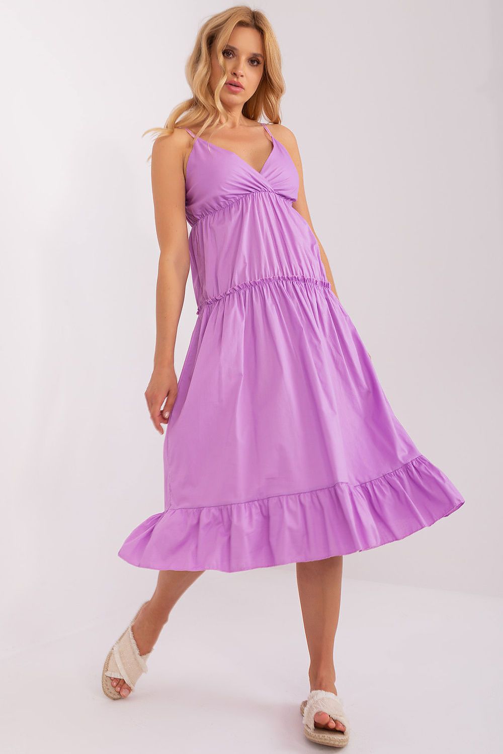 Woman wearing a purple dress on a white background